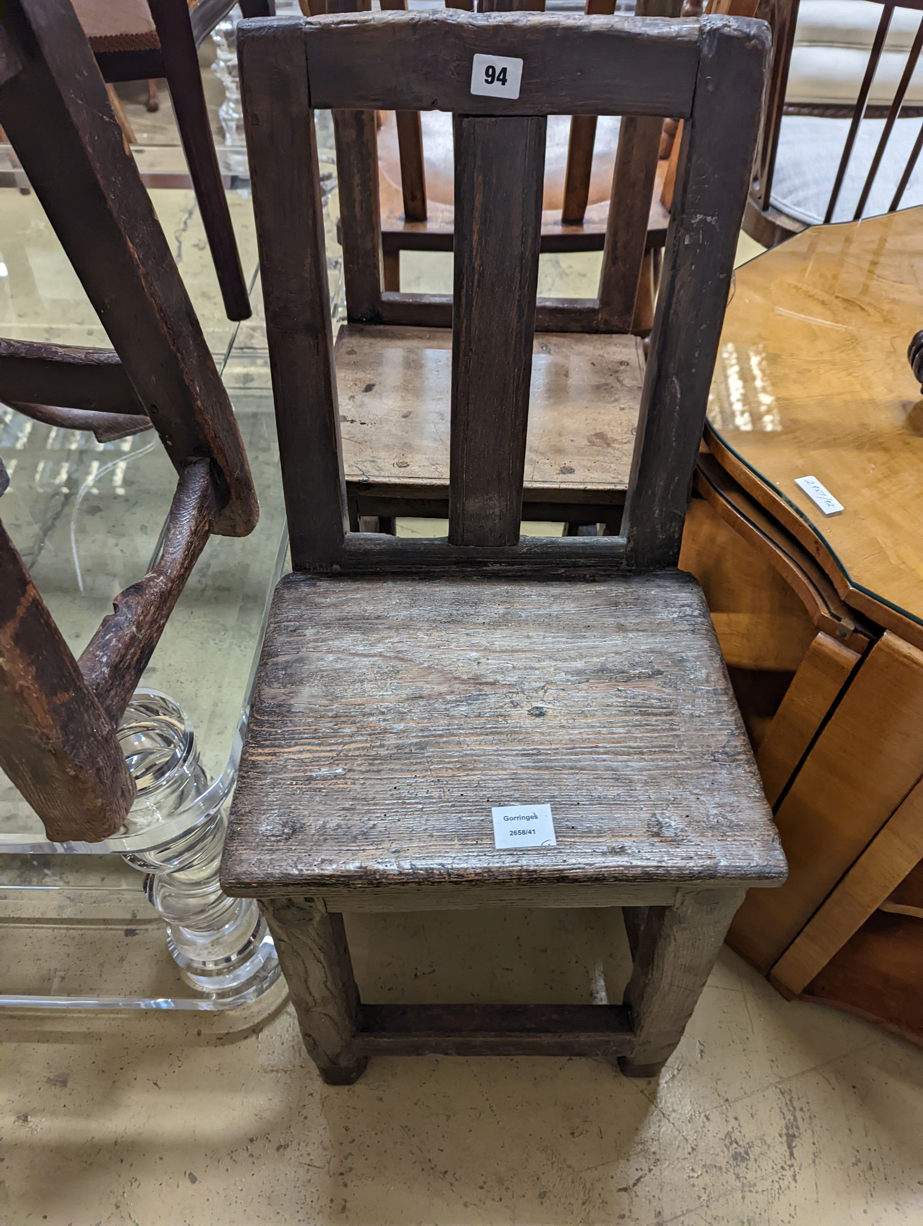 Two antique walnut or pine backstools.